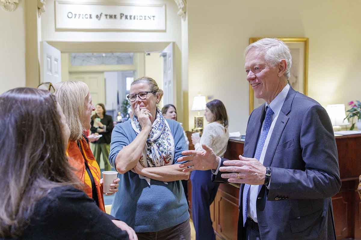 Beardsley talking with guests in the UVA Office of the President